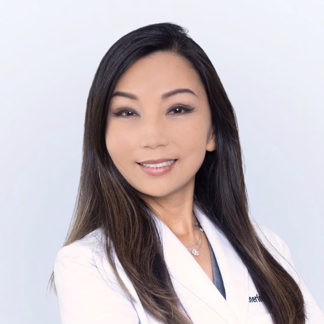 Dr. Katherine Ahn Wallace in her white coat